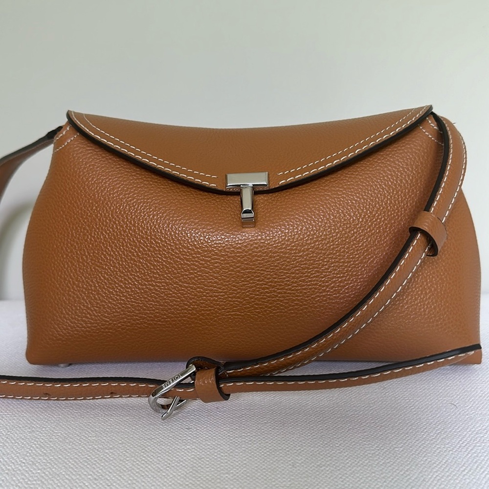 Toteme T lock clutch tan grain